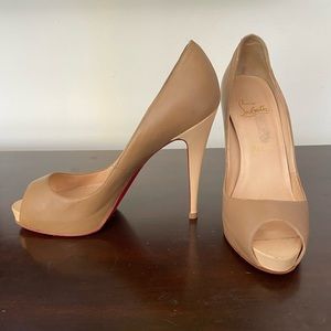 Nude Christian Louboutin peep toe heels